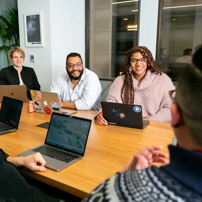 researchers sitting around conference room table